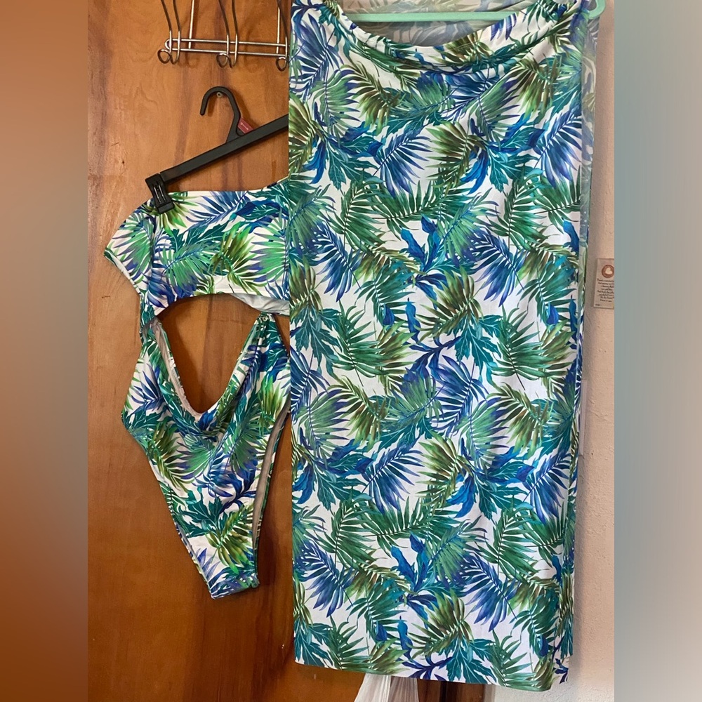 One piece bathing suit with skirt cover never worn.